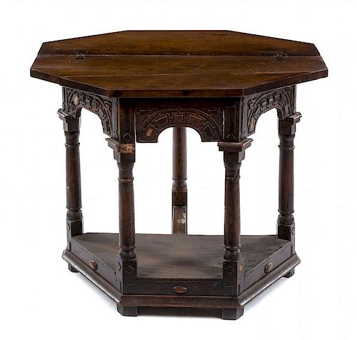 An Oak Flip-Top Table Height 29 3/8 x width 36 1/8 x depth 17 3/4 inches.