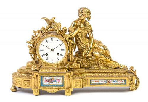 A Louis XVI Style Porcelain Mounted Gilt Bronze Mantel Clock Width 17 1/2 inches.