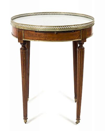 A Louis XVI Mahogany Bouillotte Table Height 29 x diameter of top 25 3/8 inches.