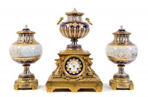 A Sevres Style Porcelain Mounted Gilt Bronze Clock Garniture Height of clock 16 1/2 inches.