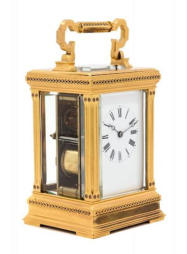 A French Gilt Bronze Carriage Clock Height 8 inches.