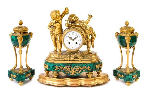 A Napoleon III Gilt Bronze and Malachite Clock Garniture Height of mantel clock 15 inches.