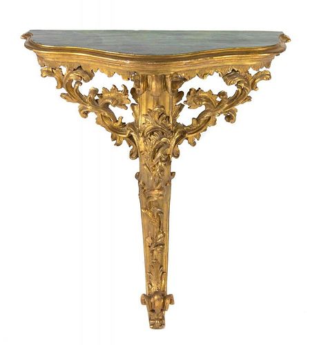 An Italian Rococo Carved Giltwood Console Table Height 37 x width 30 1/2 x depth 12 1/2 inches.