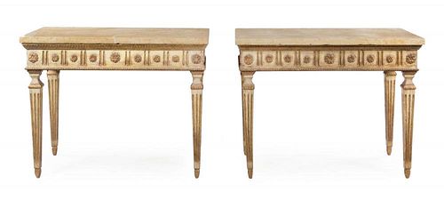 A Pair of Italian Painted and Parcel Gilt Console Tables Height 37 1/2 x width 48 x depth 25 1/2 inches.