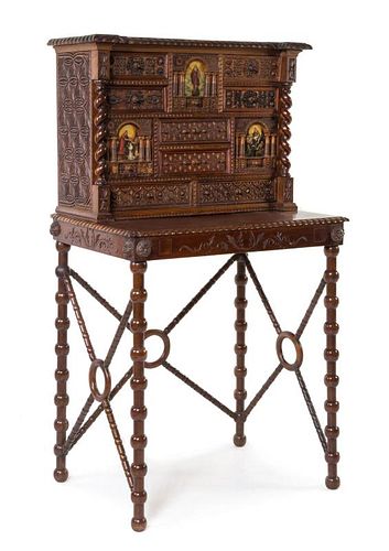 A Spanish Colonial Style Painted and Carved Walnut Cabinet on Stand Height overall 51 1/4 x width 28 1/8 x depth 20 inches.