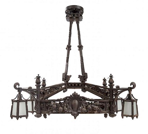 A Wrought Iron Four-Light Chandelier Height 48 x width 43 inches.