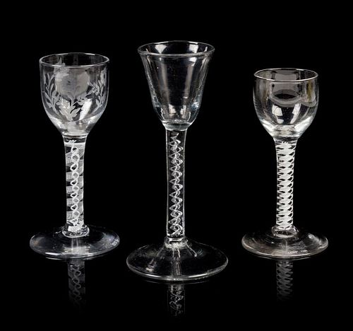 A Group of Three English Glass Wine Goblets Height of tallest 6 3/8 inches.