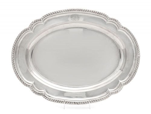 A George III Silver Platter, William Fountain, London, 1779, of oval form, having an undulating, gadroon rim, the border engr