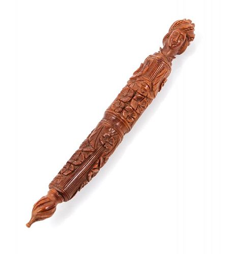 A Carved Coquia Nut Figural Needle Case Length 4 1/8 inches.