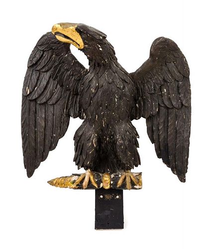 An American Carved Giltwood Figure of an Eagle Height 13 1/2 x width 14 1/2 inches.