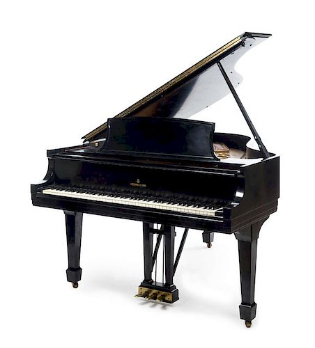 A Steinway & Sons Medium Grand Piano Height 33 1/2 x width 56 x depth 70 inches.