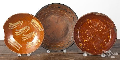 Five American redware chargers, 19th c., largest - 12 1/4'' dia.