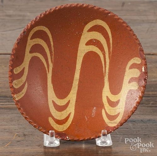 Pennsylvania redware toddy plate, 19th c., with yellow slip decoration, 5 1/4'' dia.