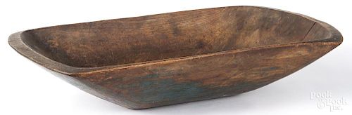 Wooden trencher, 19th c., retaining traces of an old blue surface, 23 1/4'' l.