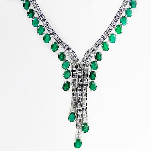 Contemporary Approx. 33.34 Carat Oval Cut Emerald, 14.02 Carat Baguette and Round Brilliant Cut Diamond and 18 Karat White