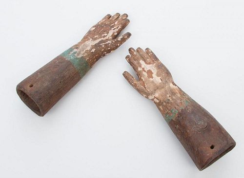 PAIR OF CARVED AND POLYCHROME DECORATED MODELS OF HANDS