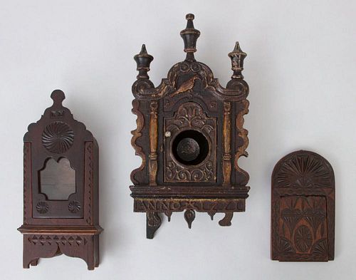 TWO CARVED WOOD WATCH STANDS AND A SMALL CASED MIRROR
