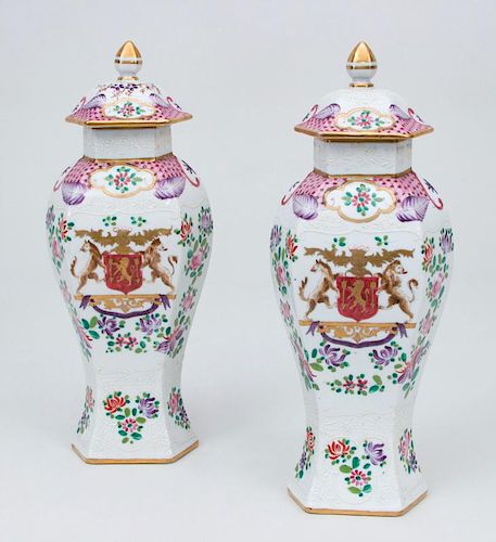 PAIR OF CHINESE EXPORT STYLE PORCELAIN ARMORIAL VASES AND COVERS