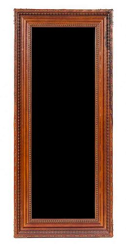 An Embossed Leather and Nailhead Trim Mirror Height 70 3/4 x width 30 1/2 inches.
