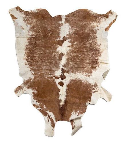 A Cow Hide Rug. Length approximately 90 inches.
