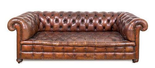 A Leather Upholstered Chesterfield Sofa Height 28 x width 80 x depth 36 inches.