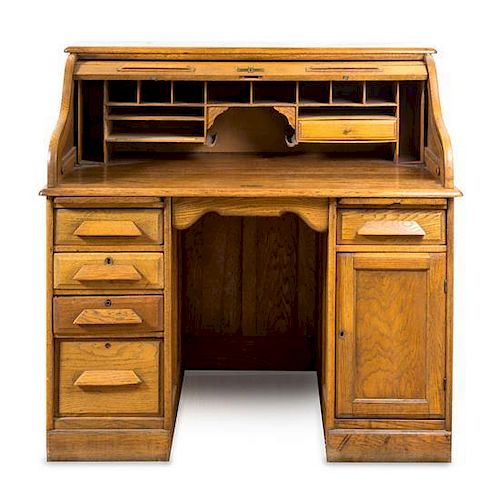 An American Oak Roll Top Desk Height 45 1/2 x width 48 x depth 30 inches.