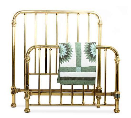 A Victorian Brass Bed and Quilt Height 59 x width 54 x depth 76 inches.
