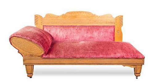 An American Oak Fainting Couch Height 34 1/2 x width 72 x depth 24 inches.