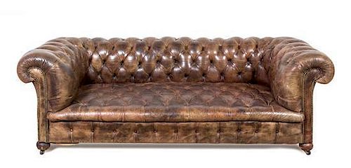 A Leather Upholstered Chesterfield Sofa Height 28 x width 81 x depth 36 inches.