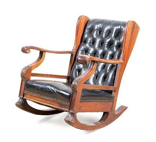 A Victorian Leather Upholstered Rocking Chair Height 34 inches.