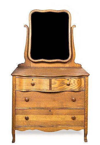 An American Oak Dresser with Mirror Height 68 x width 38 x depth 31 inches.