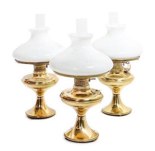 A Group of Three American Brass Oil Lamps Height overall 21 1/2 inches.