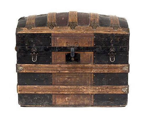 An Embossed Leather and Wood Banded Trunk Height 24 x width 27 x depth 17 inches.