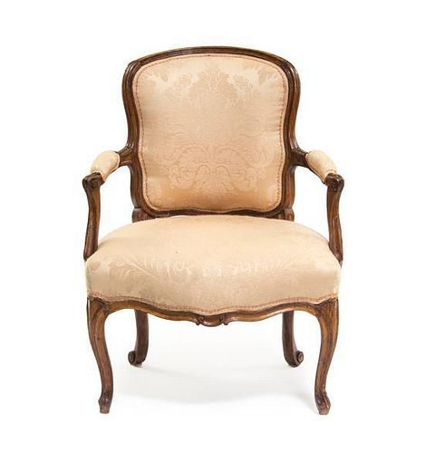 A Louis XV Walnut Fauteuil, Height 37 inches.