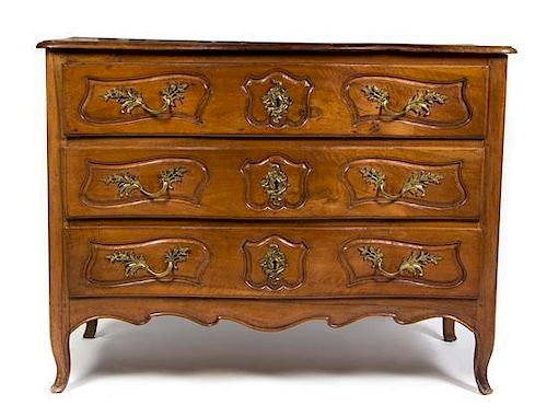 A Louis XV Provincial Walnut Commode, Height 39 1/4 x width 51 1/2 x depth 23 inches.