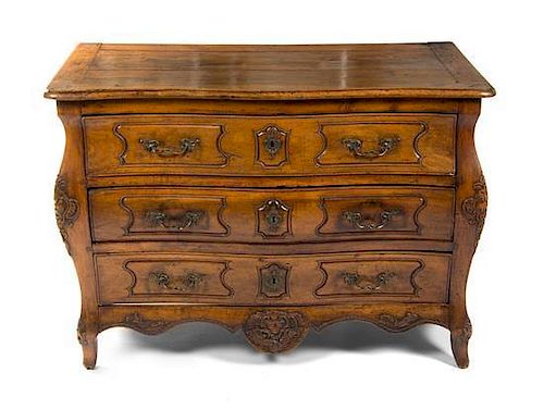 A Louis XV Provincial Walnut Commode, Height 34 x width 48 1/2 x depth 25 inches.
