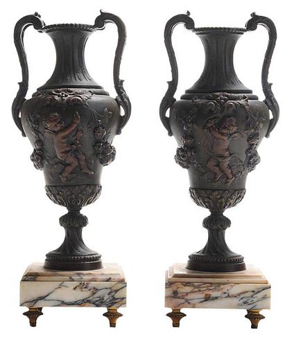 Pair of Metal Urns with Putti
