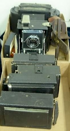 Two box lots: Group lot of folding and press cameras including B&J Press 2x3 with Kodak 105/4.5, Graflex 1A with B&L lens, Pr