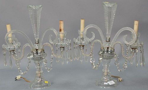 Pair of crystal candelabras having two lights and feather finial, electrified. ht. 17 1/2in., wd. 14in.