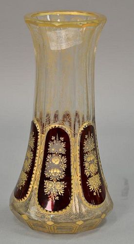 Large Bohemian ruby overlay and clear cut glass vase having overall raised gold decoration and six ruby overlay panels having
