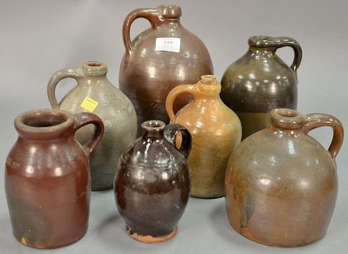 Group of seven stoneware and redware jugs. ht. 5 1/2in. to 10in.