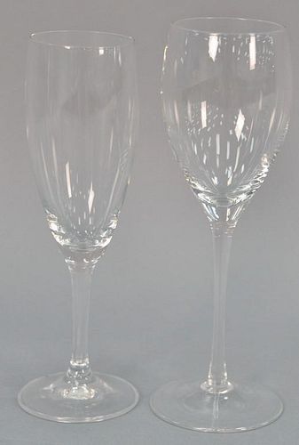 Group of thirty-three stemmed crystal glasses to include 12 white wine and 21 champagne.