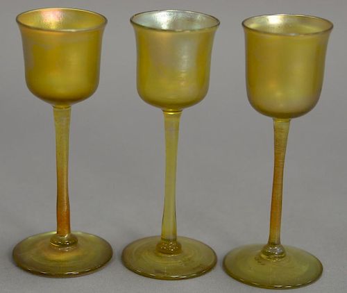 Set of three Tiffany Favrile iridescent glass intaglio cordial stem glasses, marked LCT. ht. 4 3/4in.