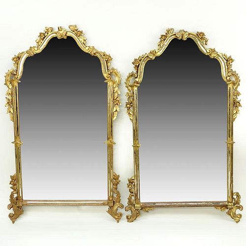 Pair of mid 20th Century Italian Carved and Giltwood Mirrors.