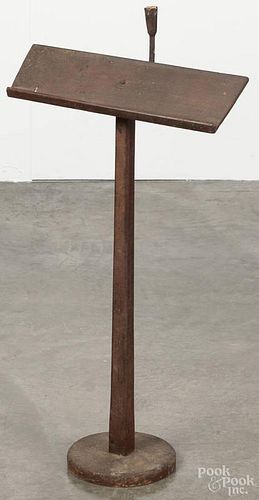 Primitive painted lectern, 19th c., with a wrought iron candleholder attachment, 33'' h.