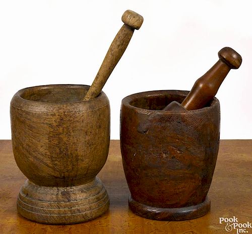 Two burlwood mortar and pestles, 18th/19th c., 7'' h. and 7 1/2'' h.