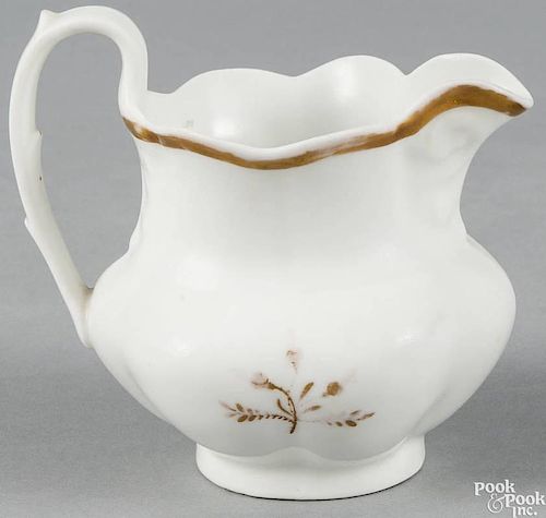 Philadelphia Tucker porcelain pitcher, ca. 1825, with a gilt floral sprig, the underside inscribed