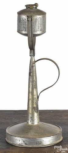 Rare gimbaled tin fat lamp, 19th c., with original hinged wall hanger on base, 11'' h.