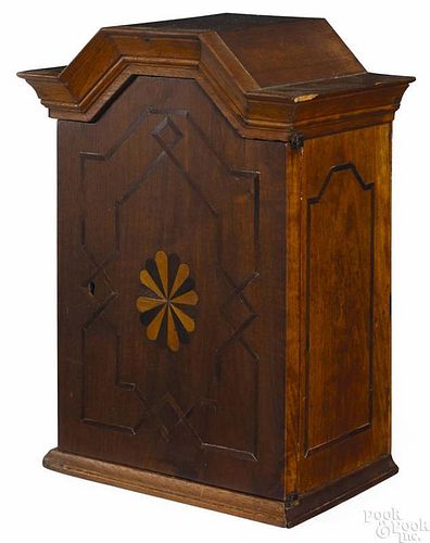 Black walnut valuables cabinet, mid/late 18th c., possibly Pennsylvania, with a faceted arch bonne