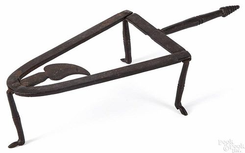 Wrought iron trivet 19th c., with boot-form feet, 2 3/4'' x 12''.